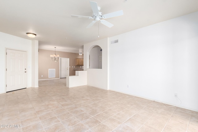 unfurnished living room featuring light tile patterned floors and ceiling fan with notable chandelier