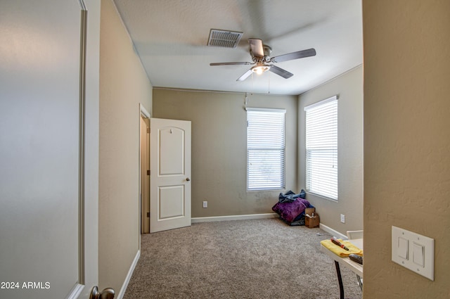 game room with visible vents, carpet floors, baseboards, and ceiling fan