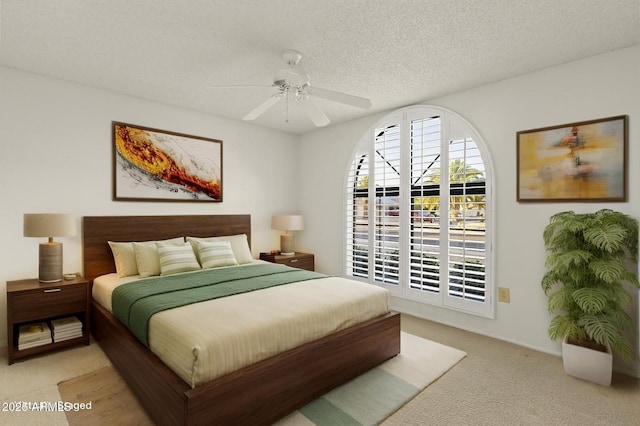 bedroom with ceiling fan and light colored carpet