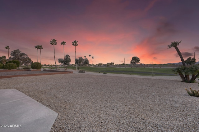 view of yard at dusk