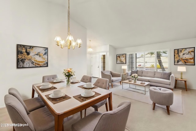 dining space with an inviting chandelier and lofted ceiling