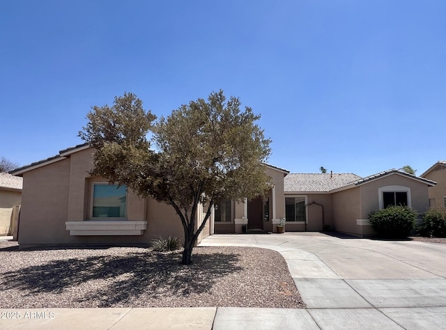 2041 E Palm Beach Dr, Chandler, AZ 85249 - view of front of home featuring stucco siding, a tiled roof, and driveway