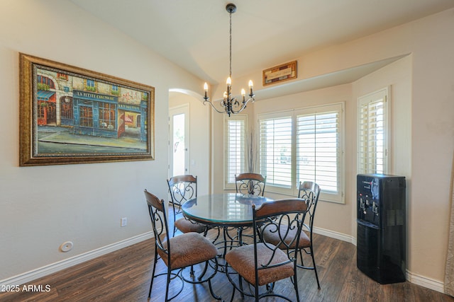 2041 E Palm Beach Dr, Chandler, AZ 85249 - dining room with a chandelier, dark wood-style floors, arched walkways, and lofted ceiling