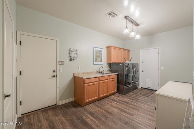2041 E Palm Beach Dr, Chandler, AZ 85249 - laundry room featuring independent washer and dryer, cabinet space, and dark wood-style floors