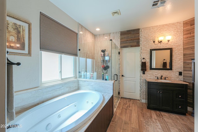 2041 E Palm Beach Dr, Chandler, AZ 85249 - full bathroom with a whirlpool tub, a shower stall, vanity, and wood finished floors