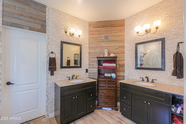2041 E Palm Beach Dr, Chandler, AZ 85249 - full bathroom with two vanities, a chandelier, and wood finished floors