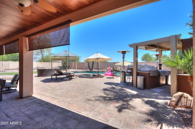 2041 E Palm Beach Dr, Chandler, AZ 85249 - fenced backyard with a patio, ceiling fan, and an outdoor kitchen