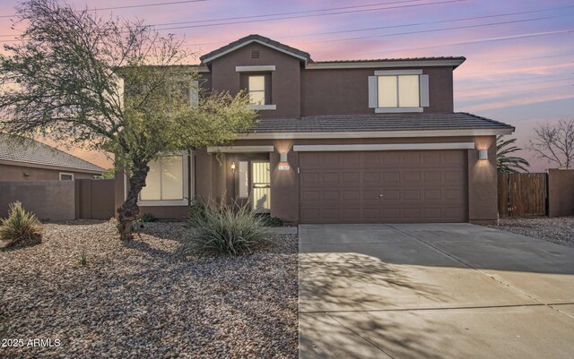 1805 E Aloe Pl, Chandler, AZ 85286 - traditional home with driveway, stucco siding, fence, an attached garage, and a tiled roof