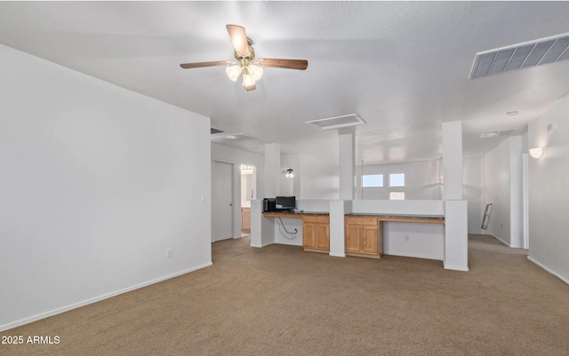 1805 E Aloe Pl, Chandler, AZ 85286 - unfurnished living room with built in study area, baseboards, carpet floors, visible vents, and a ceiling fan