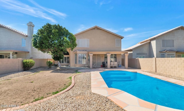 view of swimming pool with a fenced in pool, a patio, and a fenced backyard