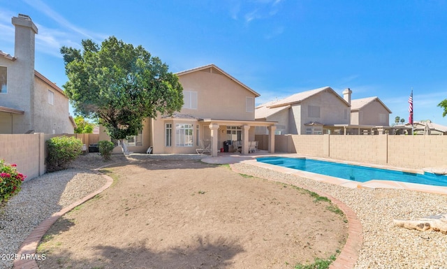 view of swimming pool with a fenced backyard, a fenced in pool, and a patio