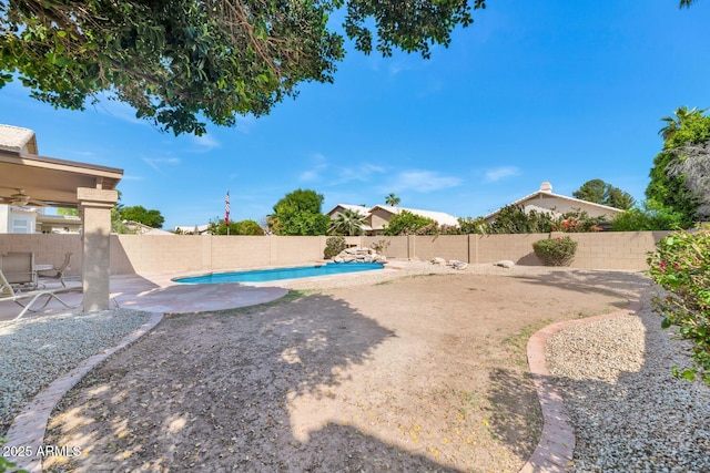 view of yard featuring a fenced in pool, a patio, and a fenced backyard