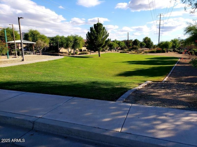 view of home's community with a yard and a gazebo