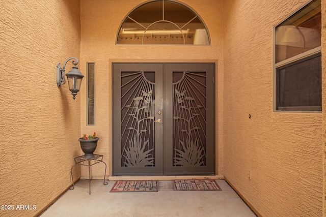 doorway to property with stucco siding