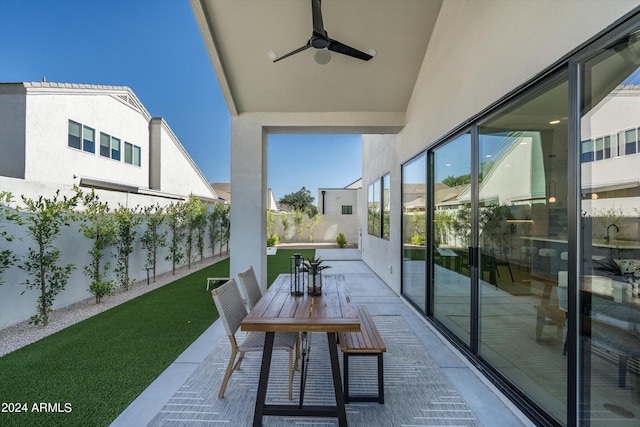 view of patio / terrace featuring ceiling fan