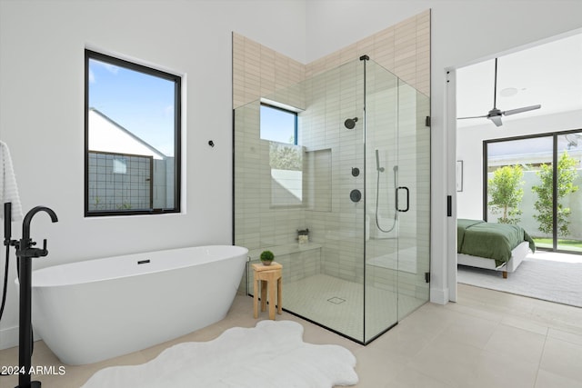 bathroom with tile patterned floors, plus walk in shower, and ceiling fan