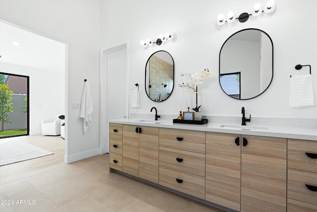 bathroom with tile patterned floors and vanity