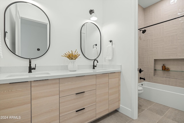 full bathroom with vanity, toilet, tile patterned floors, and tiled shower / bath