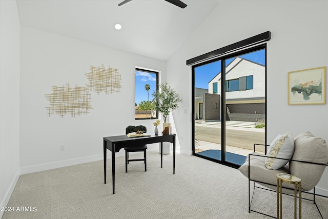 carpeted office featuring vaulted ceiling and ceiling fan