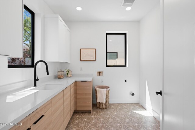 bathroom featuring tile patterned floors and sink