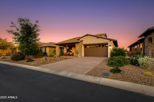 4577 Tenderfoot Way, Wickenburg, AZ 85390 - single story home with an attached garage, stucco siding, driveway, and stone siding