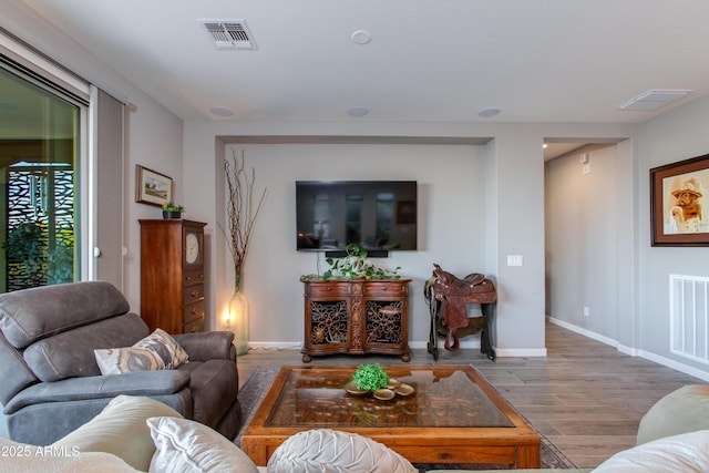 4577 Tenderfoot Way, Wickenburg, AZ 85390 - living room featuring baseboards, wood finished floors, and visible vents