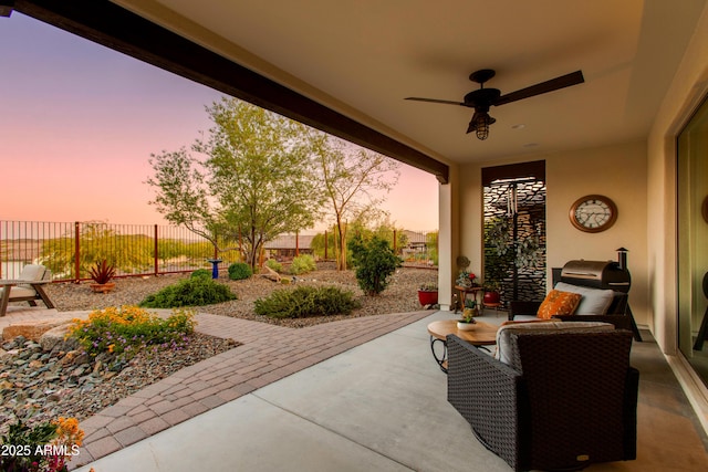 4577 Tenderfoot Way, Wickenburg, AZ 85390 - patio terrace at dusk with ceiling fan and fence