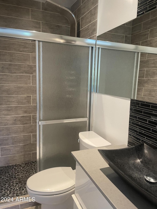 8520 E Mackenzie Dr, Scottsdale, AZ 85251 - bathroom featuring toilet, a shower stall, and vanity