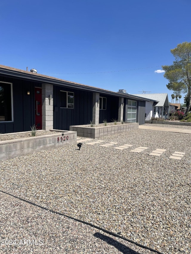 8520 E Mackenzie Dr, Scottsdale, AZ 85251 - view of front of home featuring board and batten siding