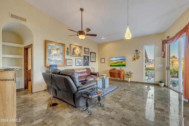 living room with ceiling fan, built in features, and high vaulted ceiling