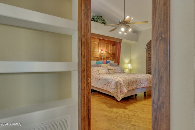 bedroom with ceiling fan and hardwood / wood-style floors