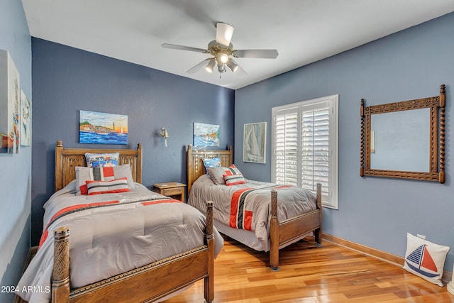 bedroom featuring ceiling fan and light hardwood / wood-style floors