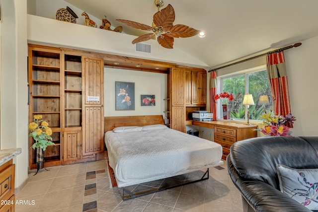 bedroom with light tile patterned flooring, vaulted ceiling, and ceiling fan