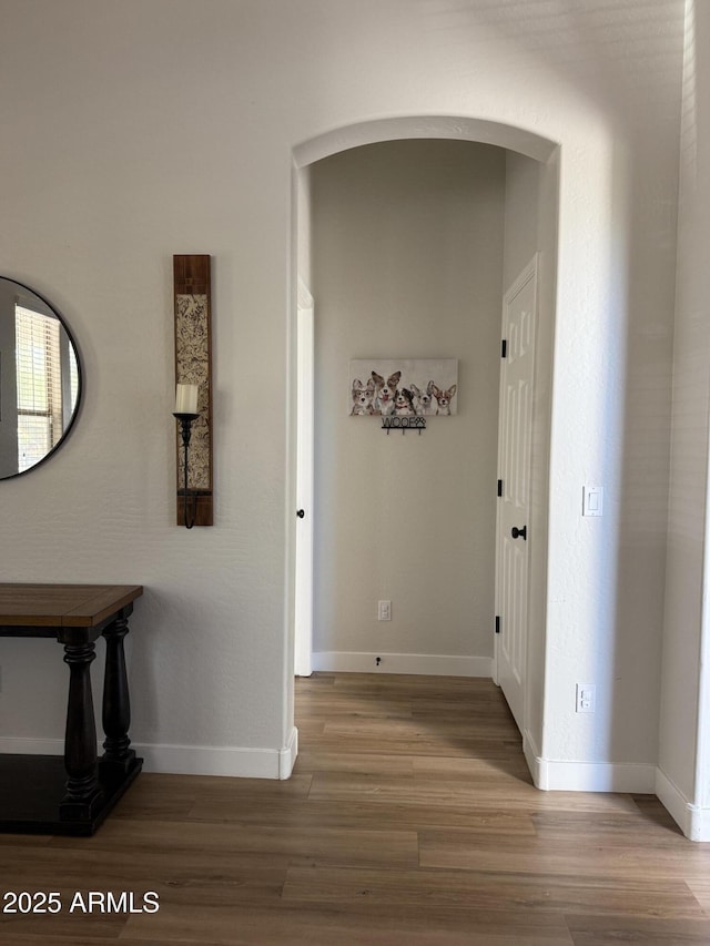 3765 N Denny Way, Buckeye, AZ 85396 - corridor featuring light wood finished floors and arched walkways