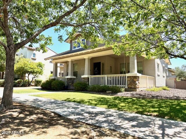 3765 N Denny Way, Buckeye, AZ 85396 - craftsman inspired home featuring covered porch, a front lawn, and stucco siding