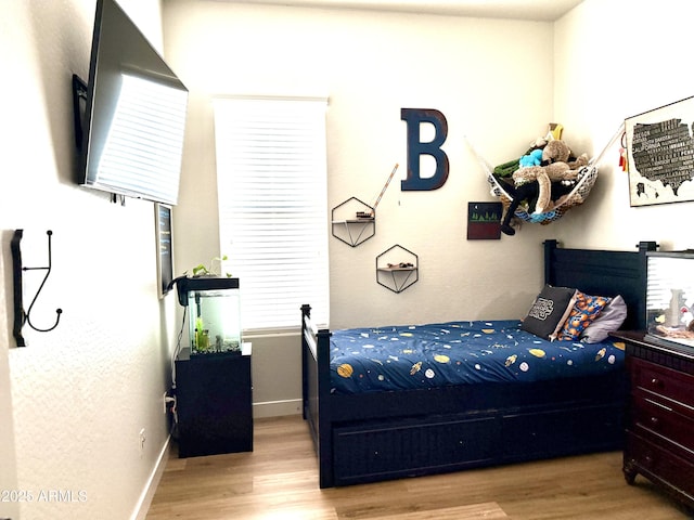 3765 N Denny Way, Buckeye, AZ 85396 - bedroom with wood finished floors and baseboards