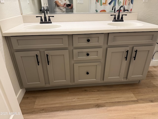 3765 N Denny Way, Buckeye, AZ 85396 - full bath featuring double vanity, wood finished floors, and a textured wall