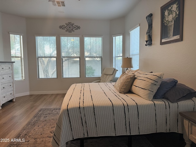 3765 N Denny Way, Buckeye, AZ 85396 - bedroom with wood finished floors and baseboards