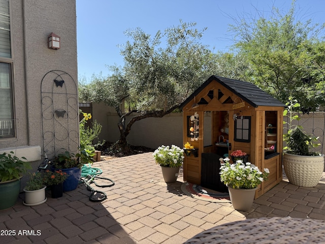 3765 N Denny Way, Buckeye, AZ 85396 - view of patio / terrace with an outbuilding
