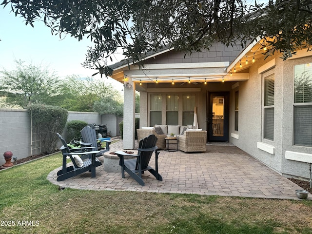 3765 N Denny Way, Buckeye, AZ 85396 - fenced backyard with a patio and an outdoor living space with a fire pit
