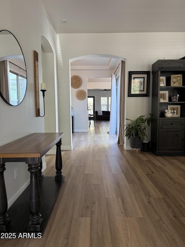 3765 N Denny Way, Buckeye, AZ 85396 - hall featuring arched walkways and wood finished floors