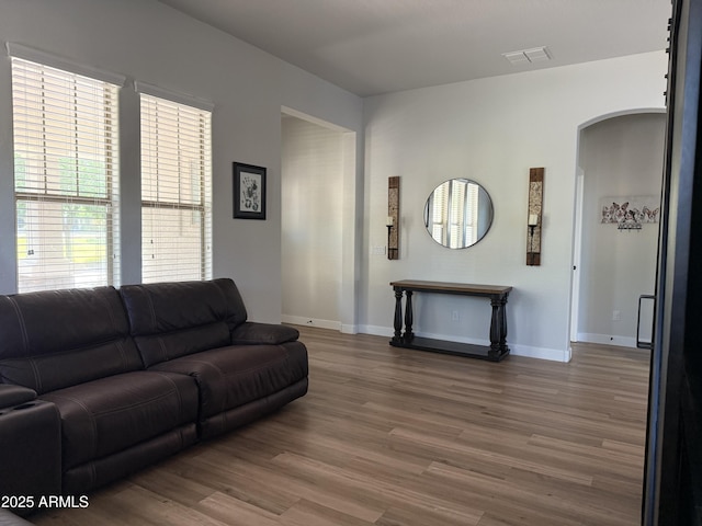 3765 N Denny Way, Buckeye, AZ 85396 - living area with arched walkways and wood finished floors