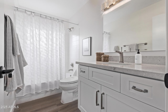 full bathroom with wood-type flooring, toilet, vanity, and shower / tub combo with curtain