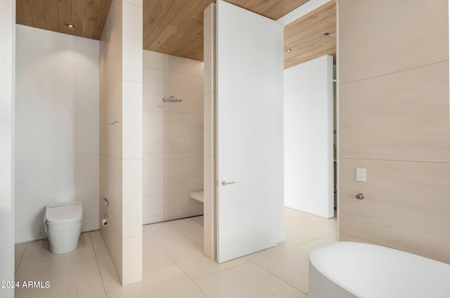 bathroom with wooden ceiling, a tub to relax in, toilet, and tile patterned flooring