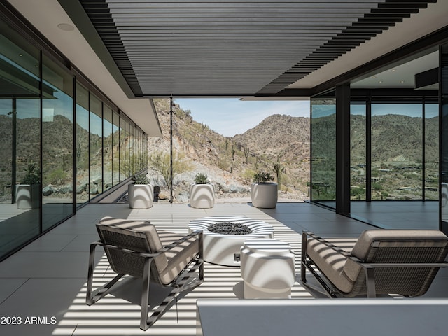 view of patio / terrace featuring a mountain view and a balcony