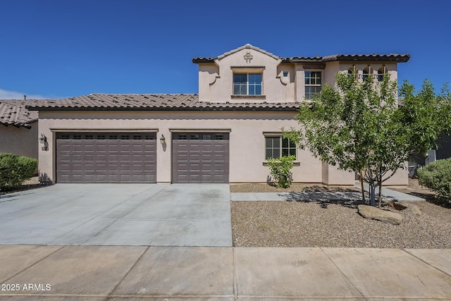 8518 S 8th Ln, Phoenix, AZ 85041 - mediterranean / spanish-style house featuring driveway, stucco siding, an attached garage, and a tiled roof