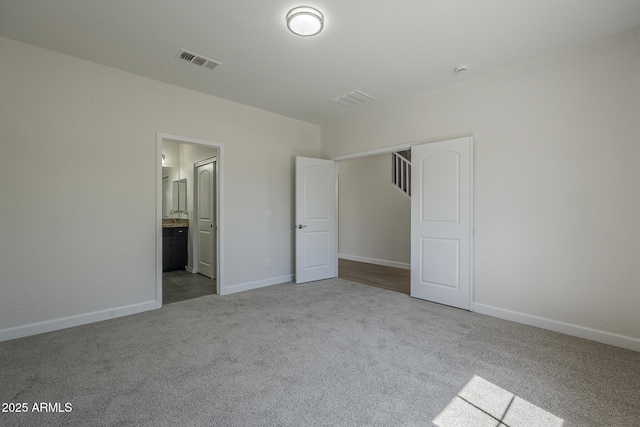 8518 S 8th Ln, Phoenix, AZ 85041 - unfurnished bedroom with carpet floors, baseboards, ensuite bathroom, and a closet