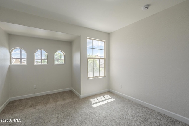 8518 S 8th Ln, Phoenix, AZ 85041 - carpeted spare room featuring a smoke detector and baseboards