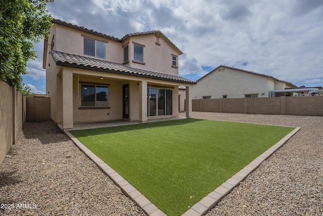 8518 S 8th Ln, Phoenix, AZ 85041 - back of property featuring stucco siding, a tile roof, and a patio