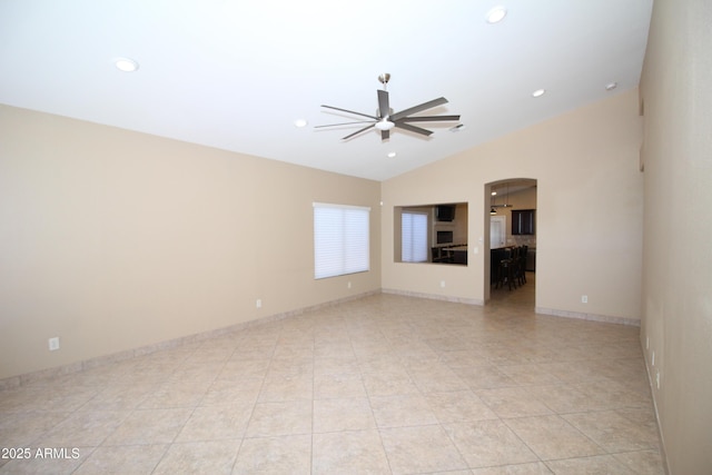 5437 W Bluefield Ave, Glendale, AZ 85308 - empty room featuring a ceiling fan, arched walkways, lofted ceiling, recessed lighting, and light tile patterned flooring